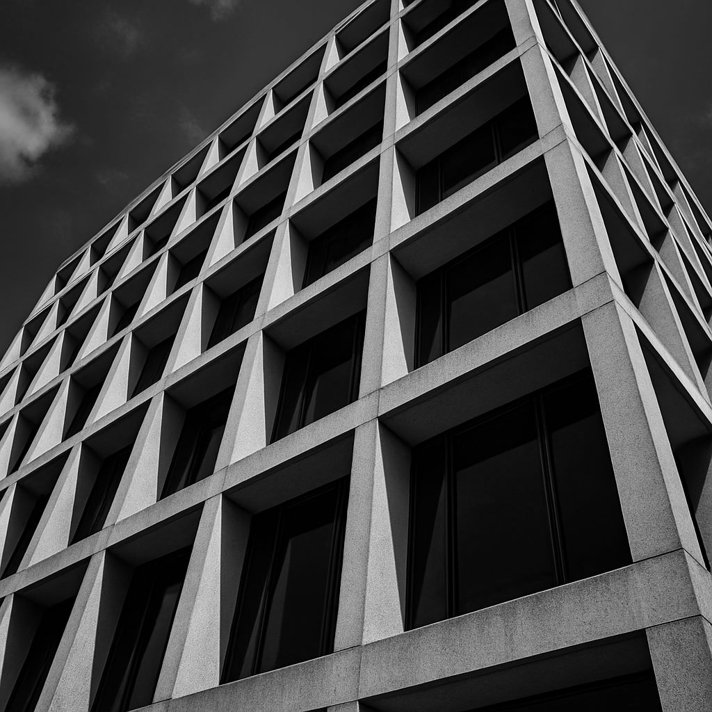 Modern minimalist building facade with strong geometric repetition